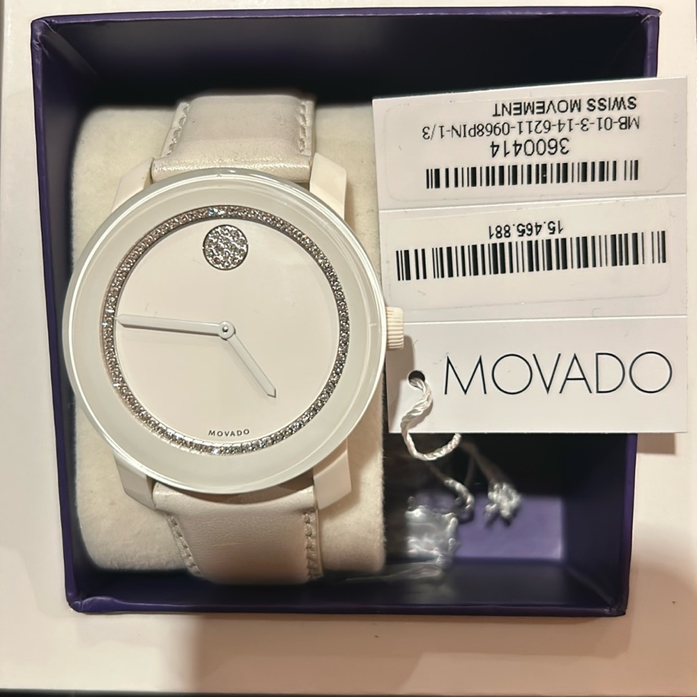 Wonderful women’s White sleek Bold Movado watch. Tags and original box.
